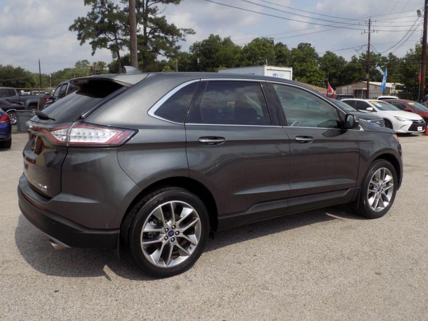 2015 GRAY FORD EDGE TITANIUM (2FMPK4K95FB) with an 2.0L engine, Automatic transmission, located at 830 E. Canino Rd., Houston, TX, 77037, (281) 405-0440, 38.358219, -81.729942 - Photo#7