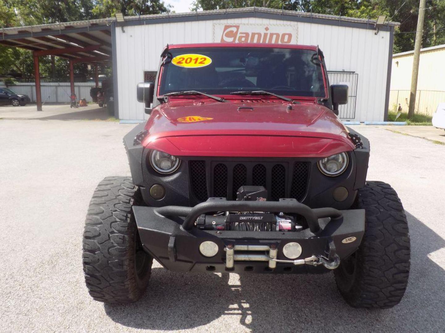 2012 MAROON JEEP WRANGLER UNLIMI SAHARA (1C4HJWEG7CL) with an 3.6L engine, Automatic transmission, located at 830 E. Canino Rd., Houston, TX, 77037, (281) 405-0440, 38.358219, -81.729942 - Photo#0