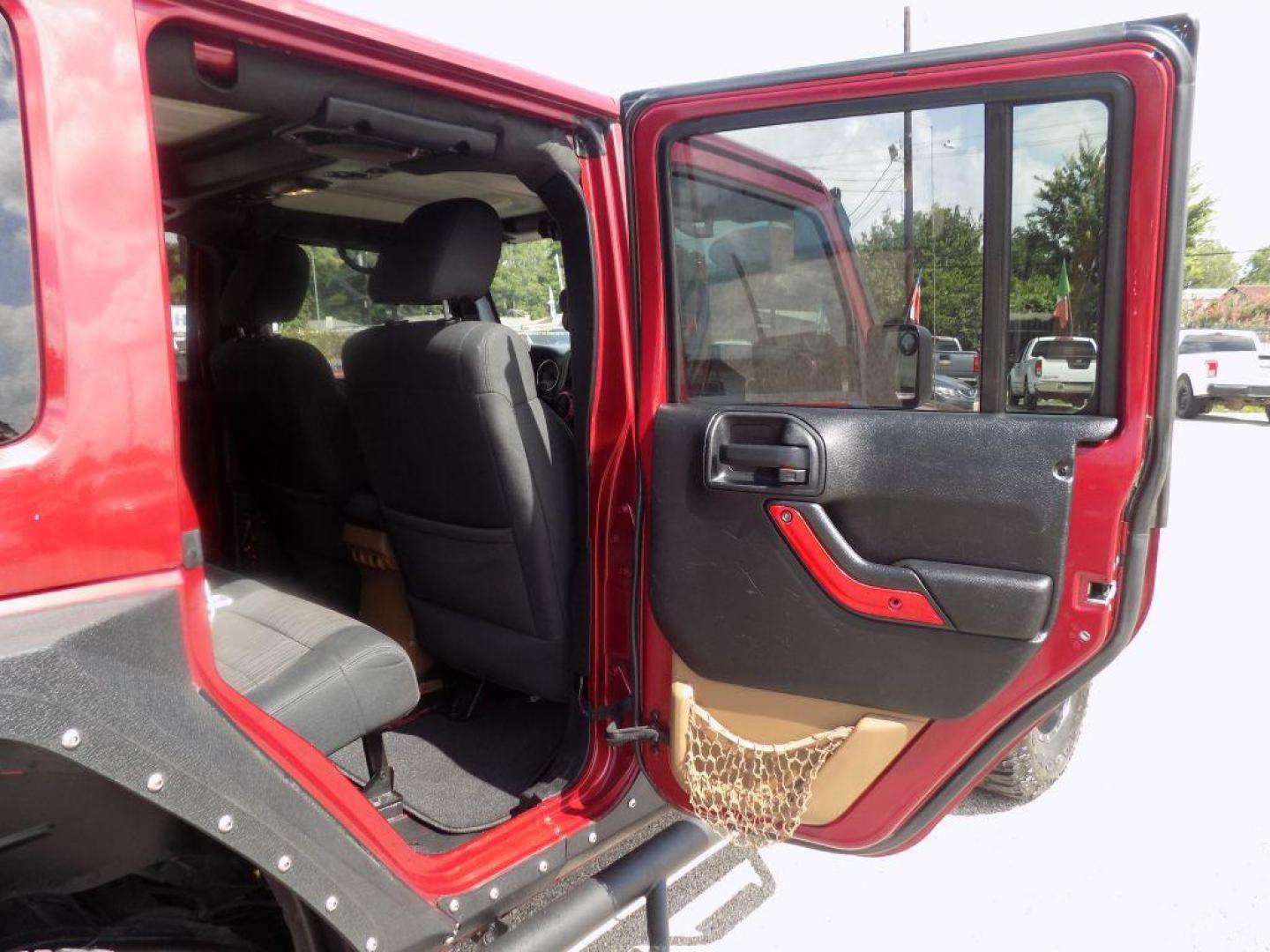 2012 MAROON JEEP WRANGLER UNLIMI SAHARA (1C4HJWEG7CL) with an 3.6L engine, Automatic transmission, located at 830 E. Canino Rd., Houston, TX, 77037, (281) 405-0440, 38.358219, -81.729942 - Photo#10