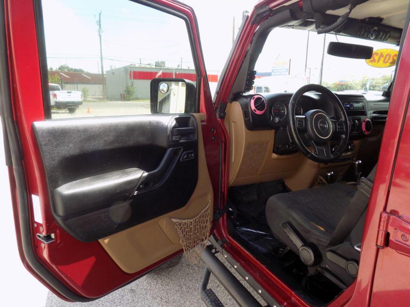 2012 MAROON JEEP WRANGLER UNLIMI SAHARA (1C4HJWEG7CL) with an 3.6L engine, Automatic transmission, located at 830 E. Canino Rd., Houston, TX, 77037, (281) 405-0440, 38.358219, -81.729942 - Photo#15