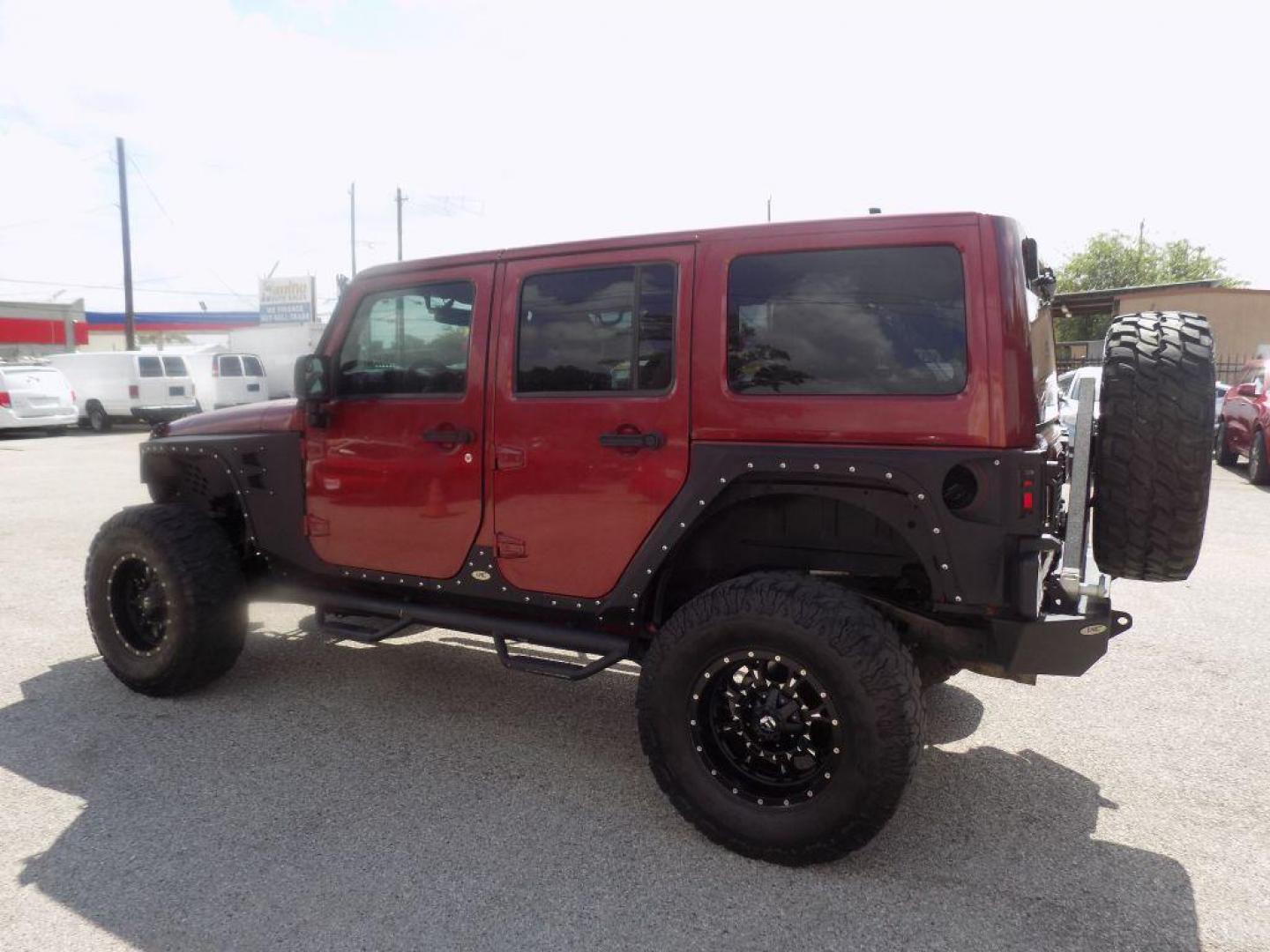 2012 MAROON JEEP WRANGLER UNLIMI SAHARA (1C4HJWEG7CL) with an 3.6L engine, Automatic transmission, located at 830 E. Canino Rd., Houston, TX, 77037, (281) 405-0440, 38.358219, -81.729942 - Photo#4