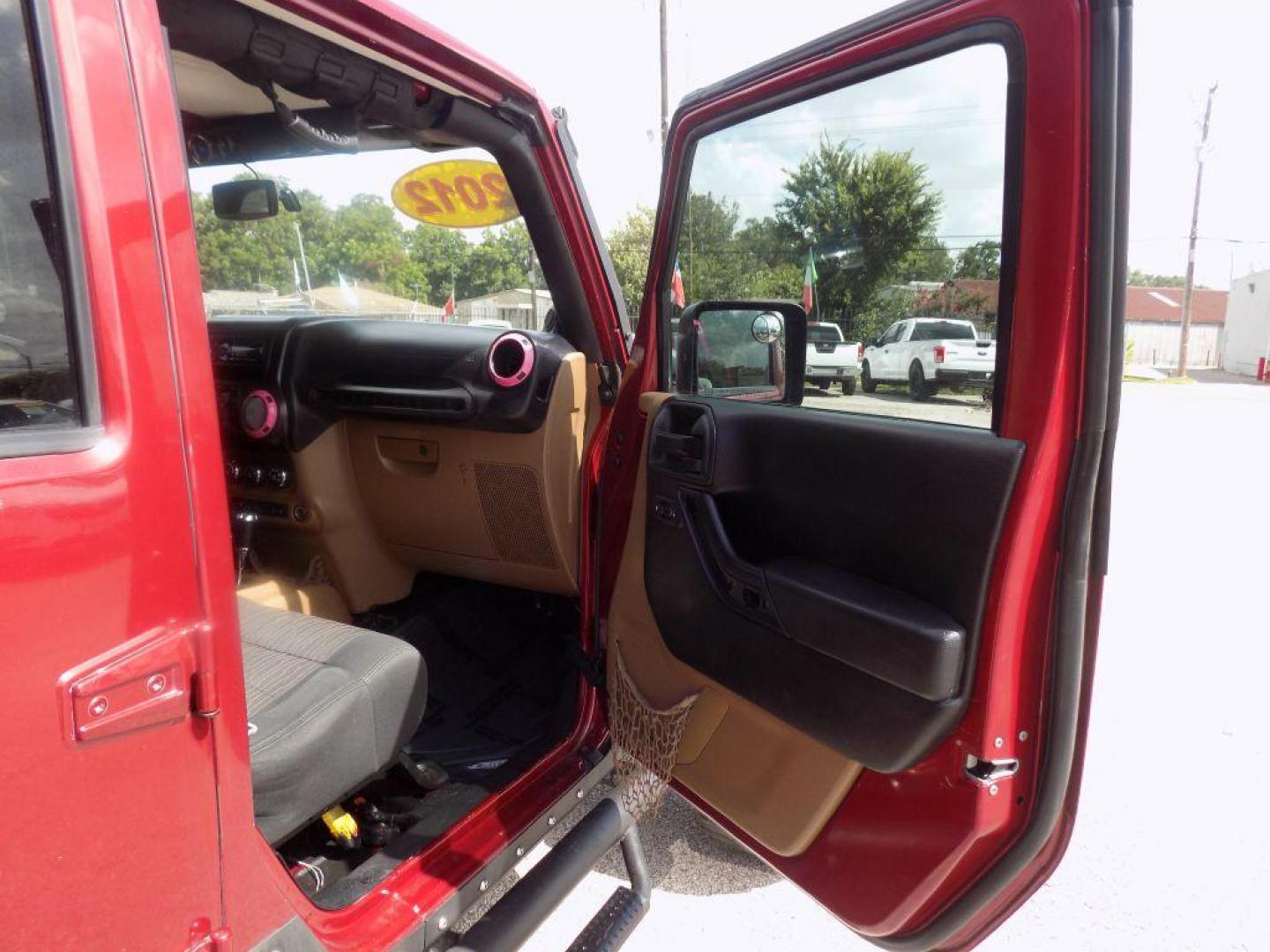 2012 MAROON JEEP WRANGLER UNLIMI SAHARA (1C4HJWEG7CL) with an 3.6L engine, Automatic transmission, located at 830 E. Canino Rd., Houston, TX, 77037, (281) 405-0440, 38.358219, -81.729942 - Photo#8