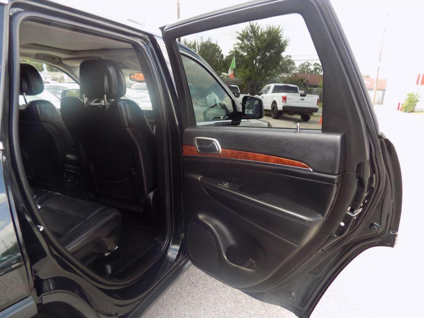 2013 GREEN JEEP GRAND CHEROKEE LIMITED (1C4RJEBT8DC) with an 5.7L engine, Automatic transmission, located at 830 E. Canino Rd., Houston, TX, 77037, (281) 405-0440, 38.358219, -81.729942 - Photo#10