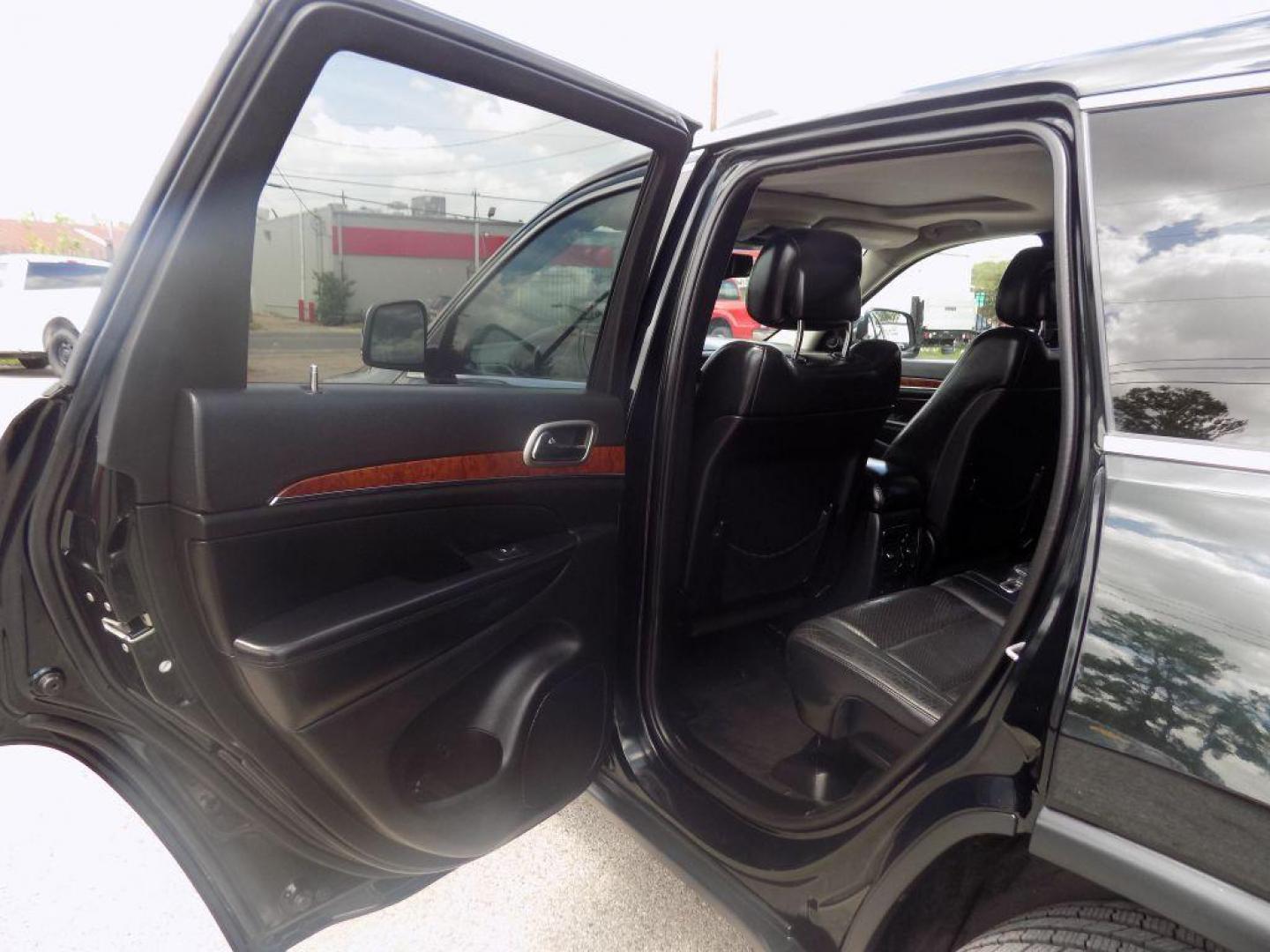 2013 GREEN JEEP GRAND CHEROKEE LIMITED (1C4RJEBT8DC) with an 5.7L engine, Automatic transmission, located at 830 E. Canino Rd., Houston, TX, 77037, (281) 405-0440, 38.358219, -81.729942 - Photo#12