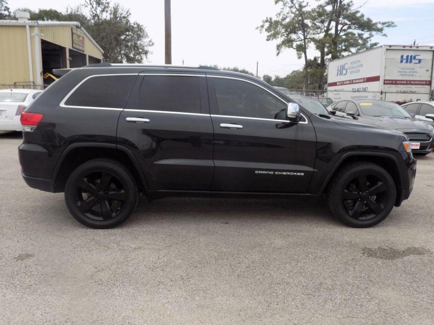 2015 BLACK JEEP GRAND CHEROKEE LIMITED (1C4RJEBGXFC) with an 3.6L engine, Automatic transmission, located at 830 E. Canino Rd., Houston, TX, 77037, (281) 405-0440, 38.358219, -81.729942 - Photo#1