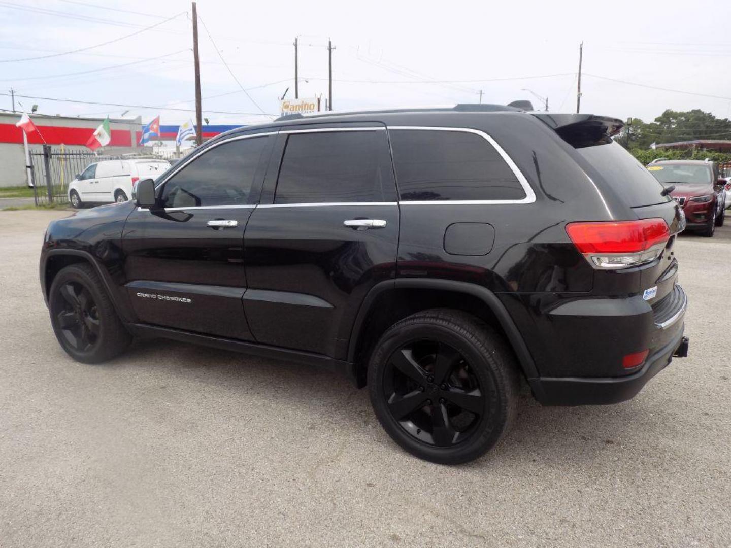 2015 BLACK JEEP GRAND CHEROKEE LIMITED (1C4RJEBGXFC) with an 3.6L engine, Automatic transmission, located at 830 E. Canino Rd., Houston, TX, 77037, (281) 405-0440, 38.358219, -81.729942 - Photo#4