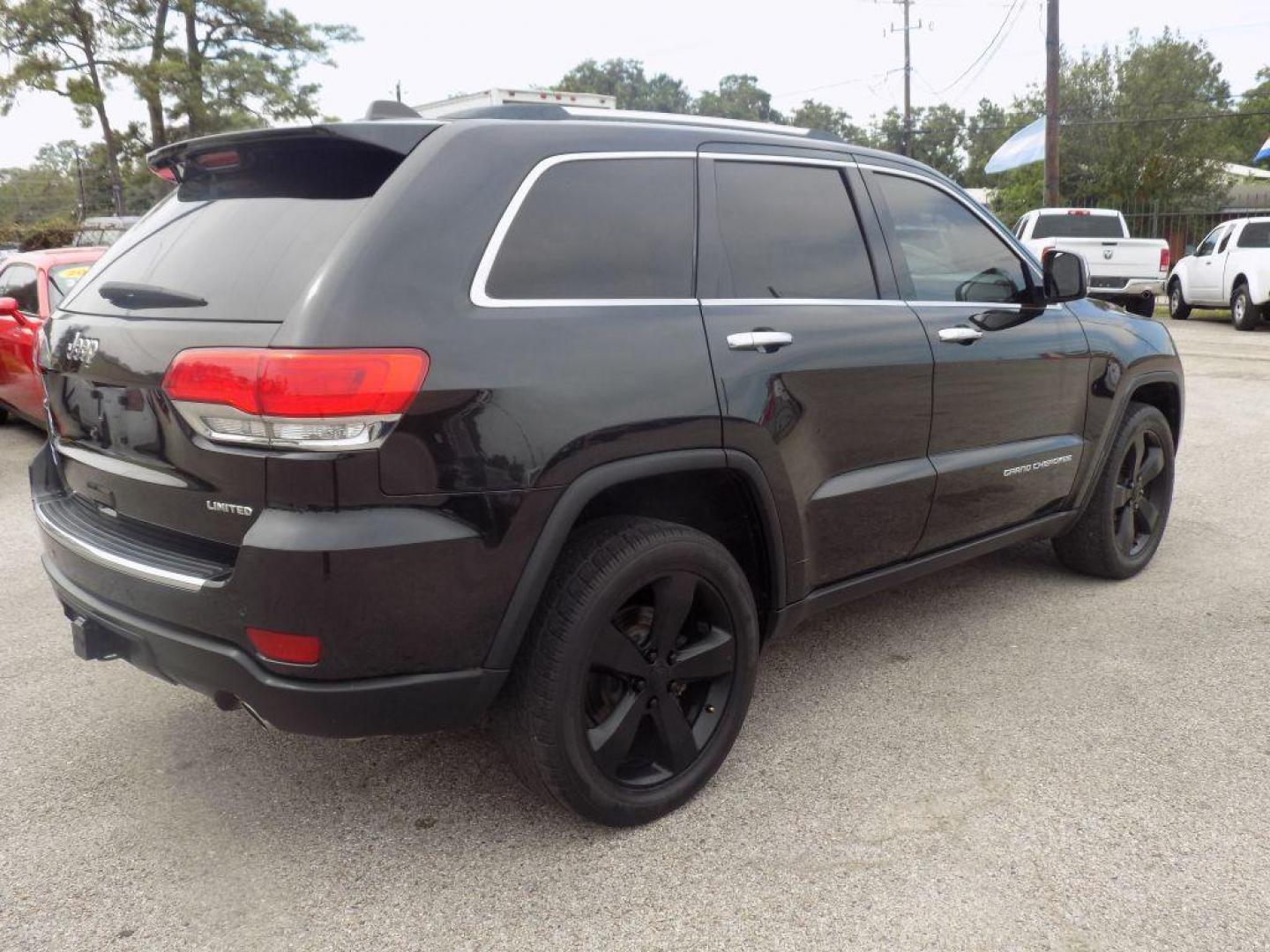 2015 BLACK JEEP GRAND CHEROKEE LIMITED (1C4RJEBGXFC) with an 3.6L engine, Automatic transmission, located at 830 E. Canino Rd., Houston, TX, 77037, (281) 405-0440, 38.358219, -81.729942 - Photo#7