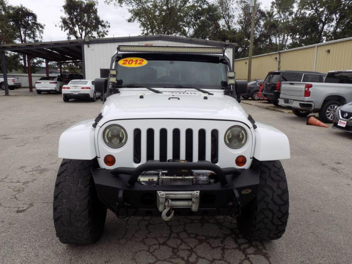 2012 WHITE JEEP WRANGLER UNLIMI SPORT (1C4HJWDG4CL) with an 3.6L engine, Automatic transmission, located at 830 E. Canino Rd., Houston, TX, 77037, (281) 405-0440, 38.358219, -81.729942 - Photo#0