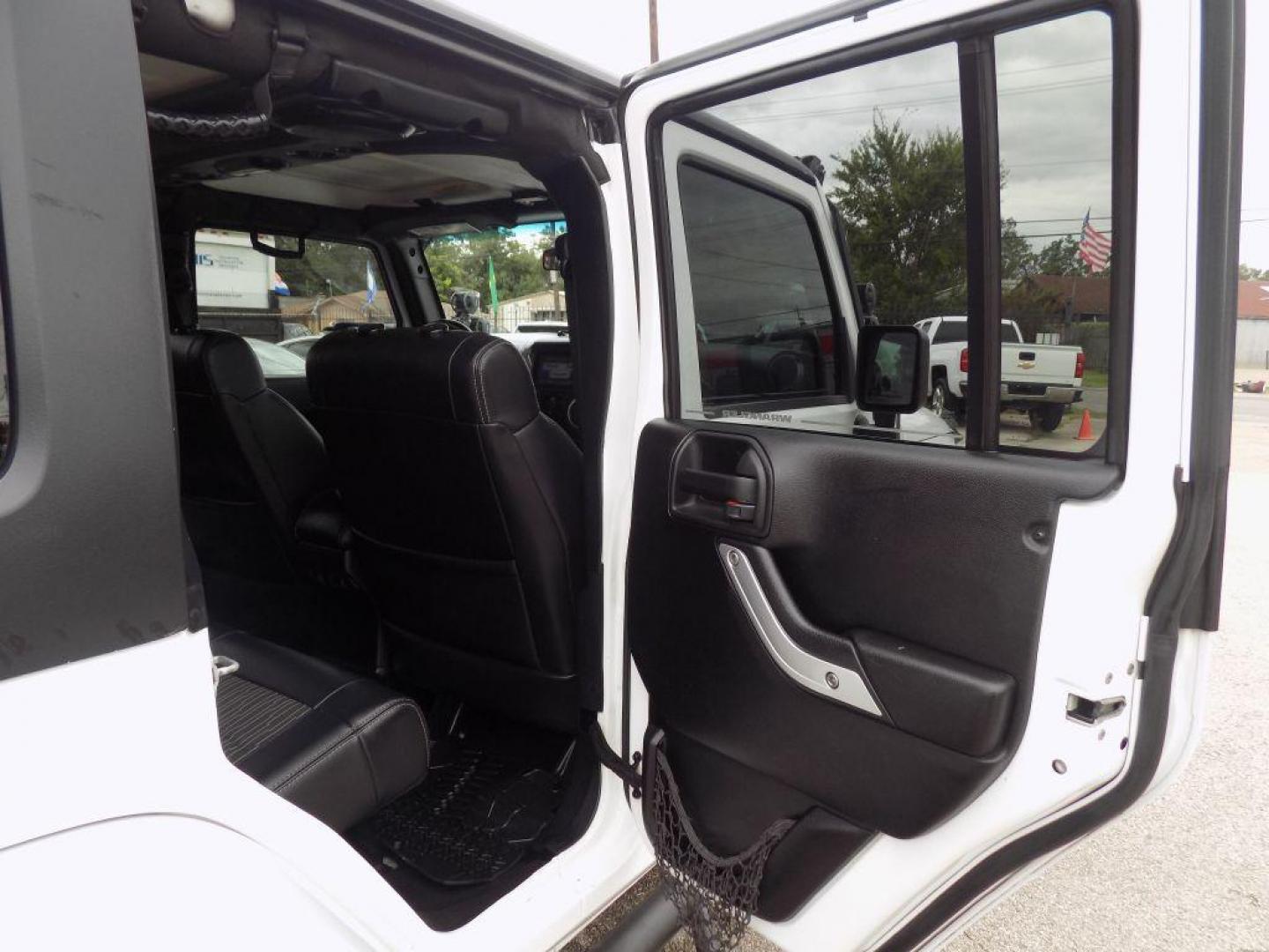 2012 WHITE JEEP WRANGLER UNLIMI SPORT (1C4HJWDG4CL) with an 3.6L engine, Automatic transmission, located at 830 E. Canino Rd., Houston, TX, 77037, (281) 405-0440, 38.358219, -81.729942 - Photo#10