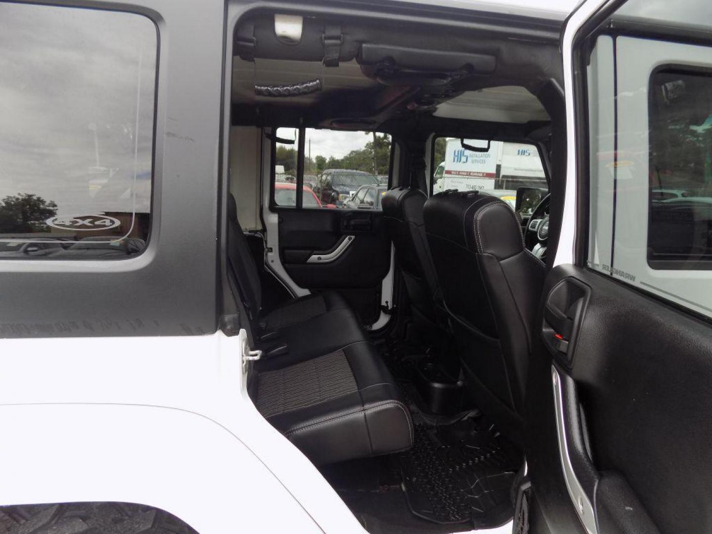 2012 WHITE JEEP WRANGLER UNLIMI SPORT (1C4HJWDG4CL) with an 3.6L engine, Automatic transmission, located at 830 E. Canino Rd., Houston, TX, 77037, (281) 405-0440, 38.358219, -81.729942 - Photo#11