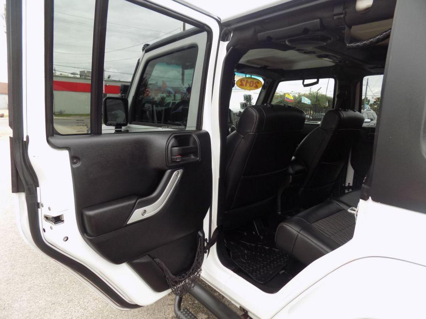 2012 WHITE JEEP WRANGLER UNLIMI SPORT (1C4HJWDG4CL) with an 3.6L engine, Automatic transmission, located at 830 E. Canino Rd., Houston, TX, 77037, (281) 405-0440, 38.358219, -81.729942 - Photo#12