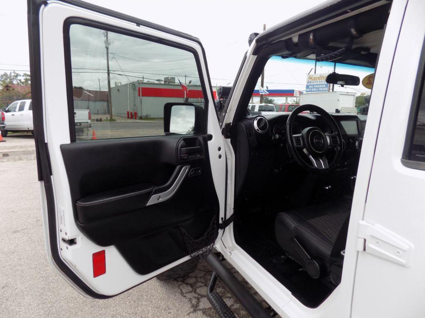 2012 WHITE JEEP WRANGLER UNLIMI SPORT (1C4HJWDG4CL) with an 3.6L engine, Automatic transmission, located at 830 E. Canino Rd., Houston, TX, 77037, (281) 405-0440, 38.358219, -81.729942 - Photo#15