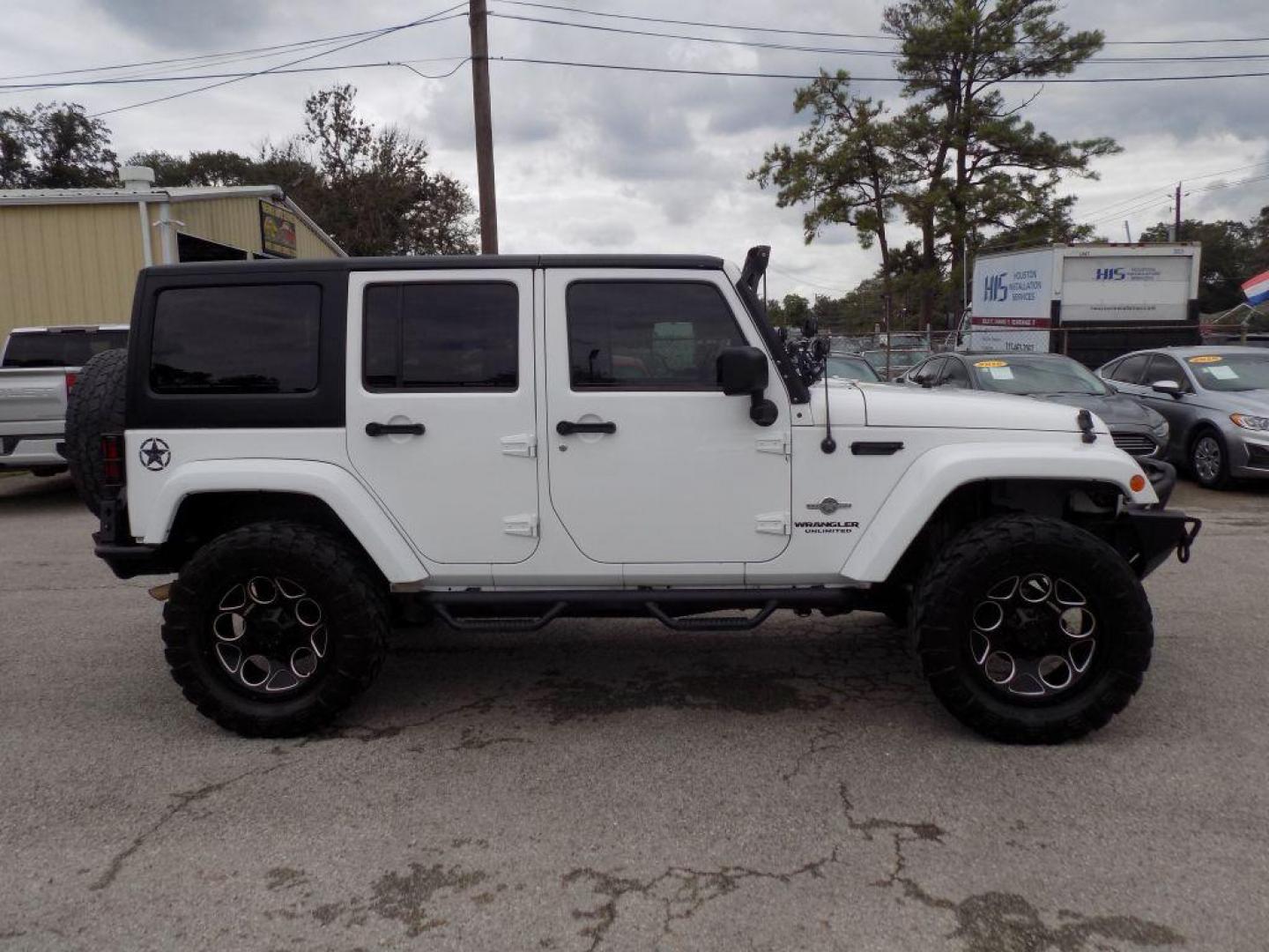 2012 WHITE JEEP WRANGLER UNLIMI SPORT (1C4HJWDG4CL) with an 3.6L engine, Automatic transmission, located at 830 E. Canino Rd., Houston, TX, 77037, (281) 405-0440, 38.358219, -81.729942 - Photo#1