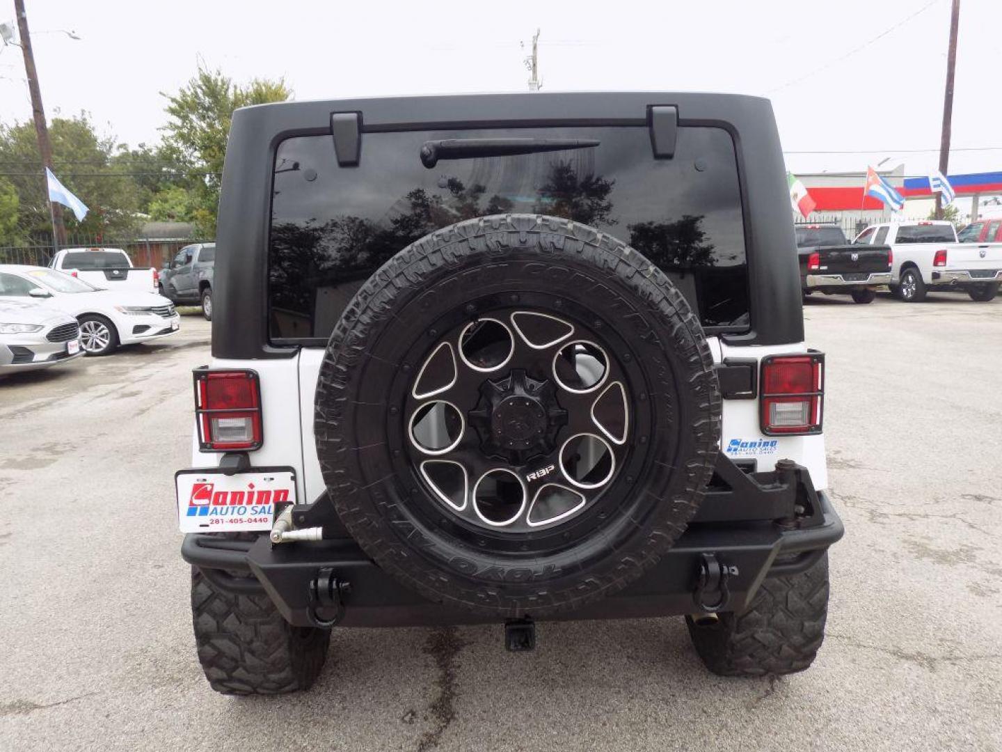 2012 WHITE JEEP WRANGLER UNLIMI SPORT (1C4HJWDG4CL) with an 3.6L engine, Automatic transmission, located at 830 E. Canino Rd., Houston, TX, 77037, (281) 405-0440, 38.358219, -81.729942 - Photo#2