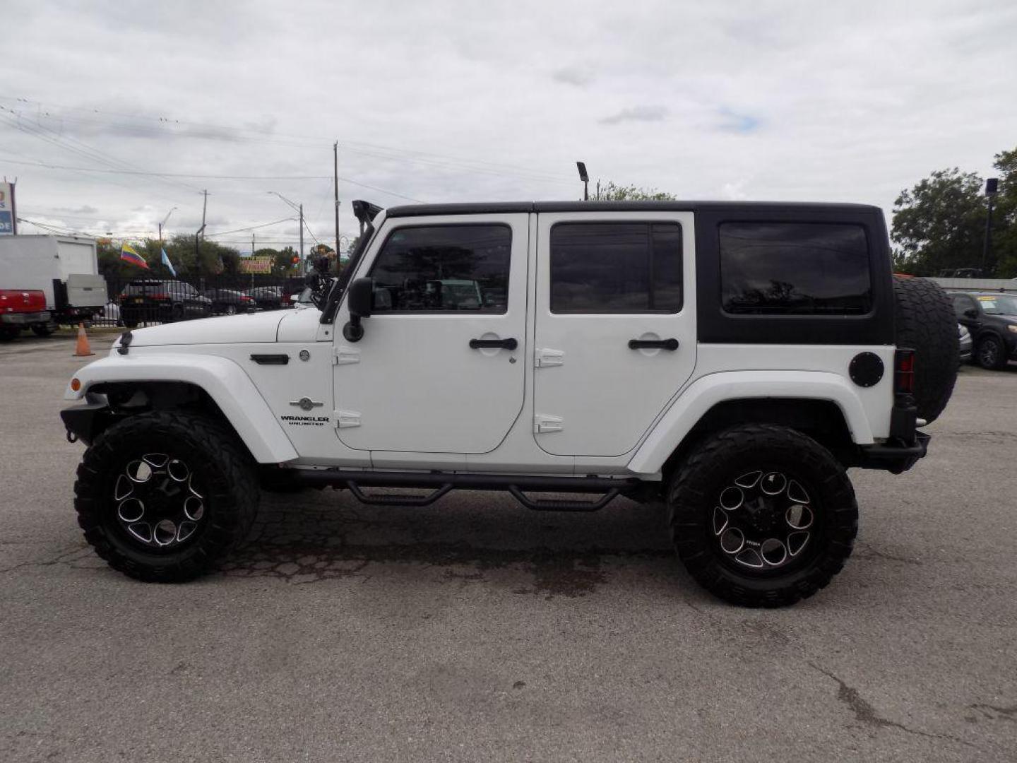 2012 WHITE JEEP WRANGLER UNLIMI SPORT (1C4HJWDG4CL) with an 3.6L engine, Automatic transmission, located at 830 E. Canino Rd., Houston, TX, 77037, (281) 405-0440, 38.358219, -81.729942 - Photo#3