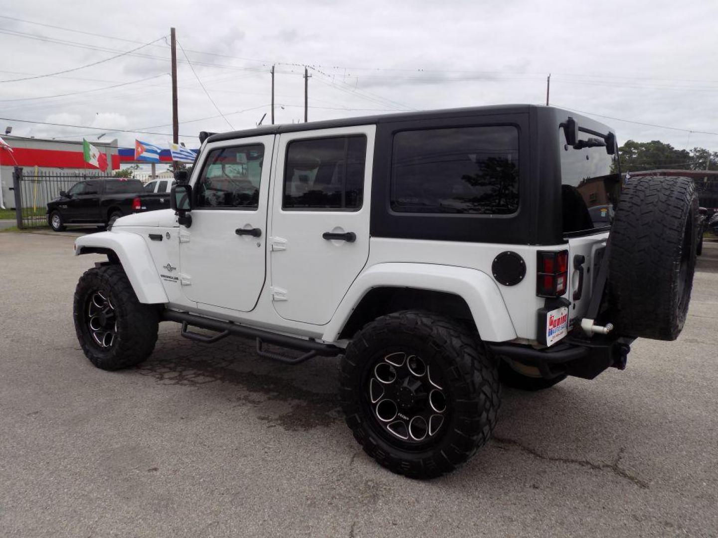 2012 WHITE JEEP WRANGLER UNLIMI SPORT (1C4HJWDG4CL) with an 3.6L engine, Automatic transmission, located at 830 E. Canino Rd., Houston, TX, 77037, (281) 405-0440, 38.358219, -81.729942 - Photo#4