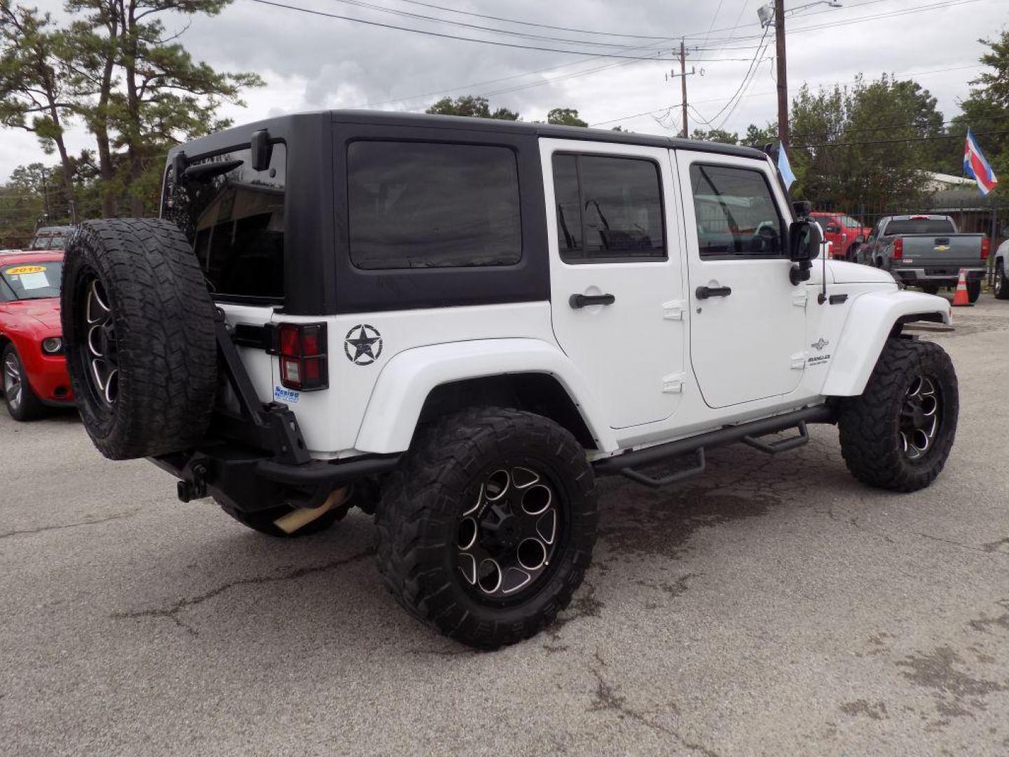 2012 WHITE JEEP WRANGLER UNLIMI SPORT (1C4HJWDG4CL) with an 3.6L engine, Automatic transmission, located at 830 E. Canino Rd., Houston, TX, 77037, (281) 405-0440, 38.358219, -81.729942 - Photo#7