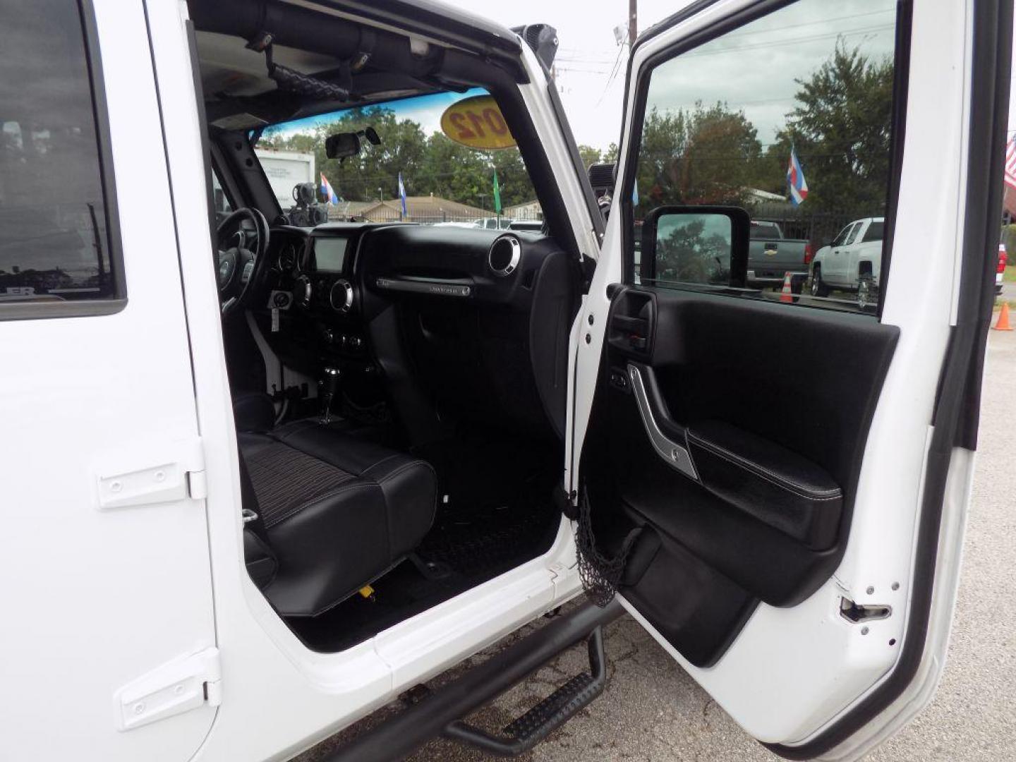 2012 WHITE JEEP WRANGLER UNLIMI SPORT (1C4HJWDG4CL) with an 3.6L engine, Automatic transmission, located at 830 E. Canino Rd., Houston, TX, 77037, (281) 405-0440, 38.358219, -81.729942 - Photo#8