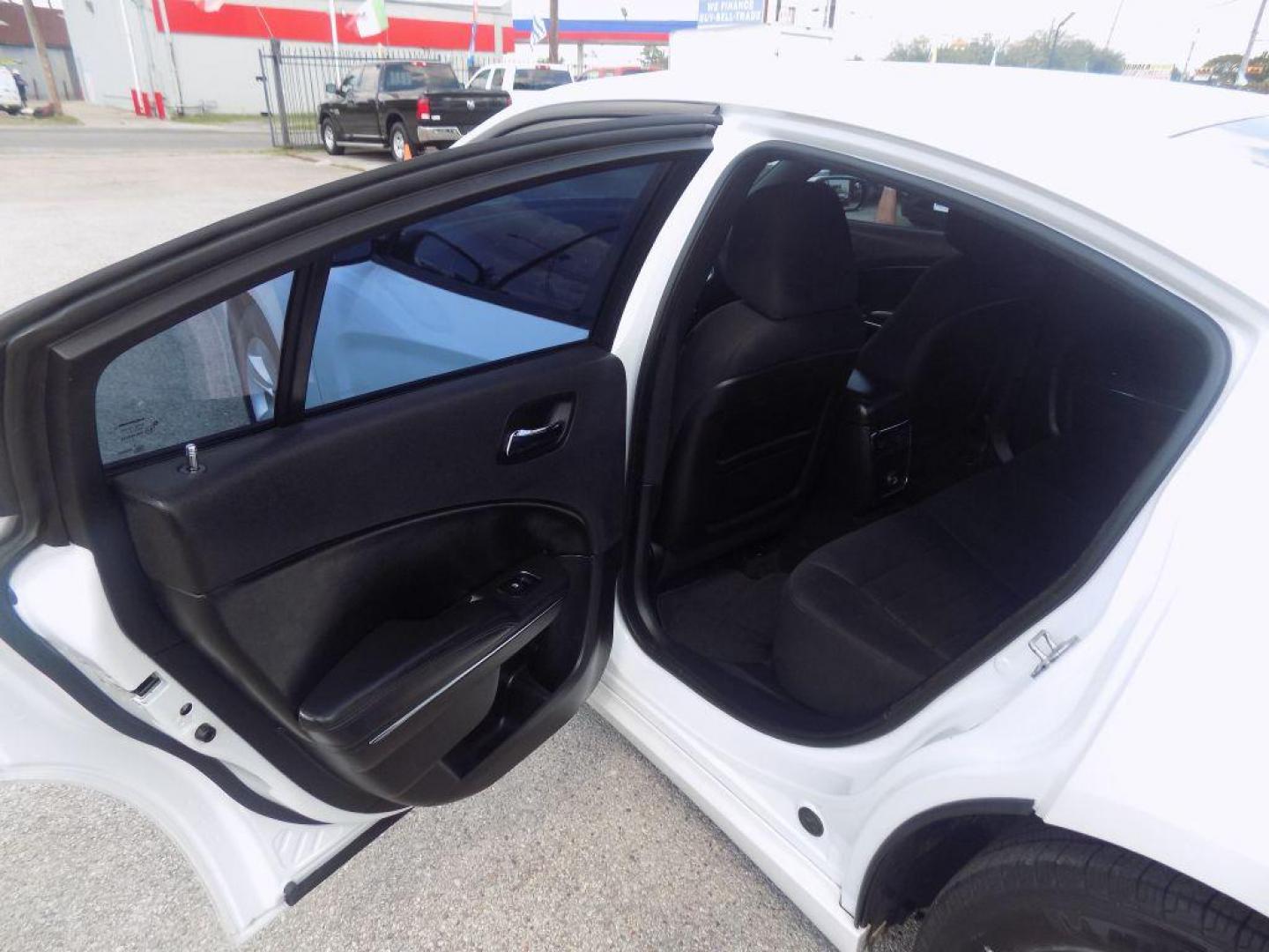 2014 WHITE DODGE CHARGER SE (2C3CDXBGXEH) with an 3.6L engine, Automatic transmission, located at 830 E. Canino Rd., Houston, TX, 77037, (281) 405-0440, 38.358219, -81.729942 - Photo#12