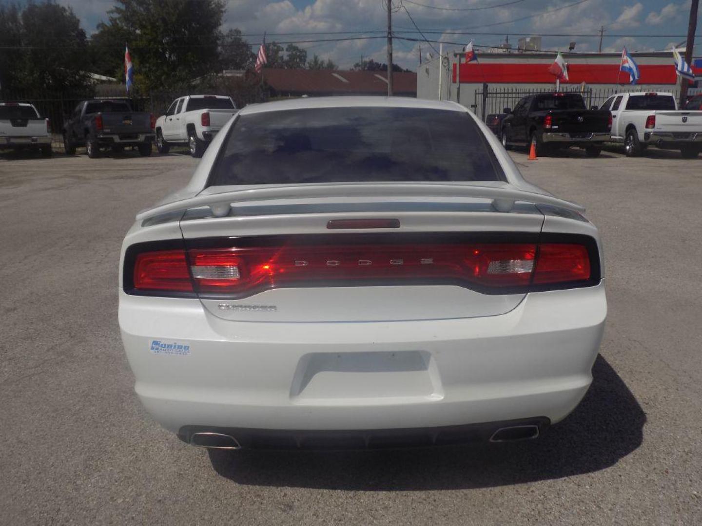 2014 WHITE DODGE CHARGER SE (2C3CDXBGXEH) with an 3.6L engine, Automatic transmission, located at 830 E. Canino Rd., Houston, TX, 77037, (281) 405-0440, 38.358219, -81.729942 - Photo#2