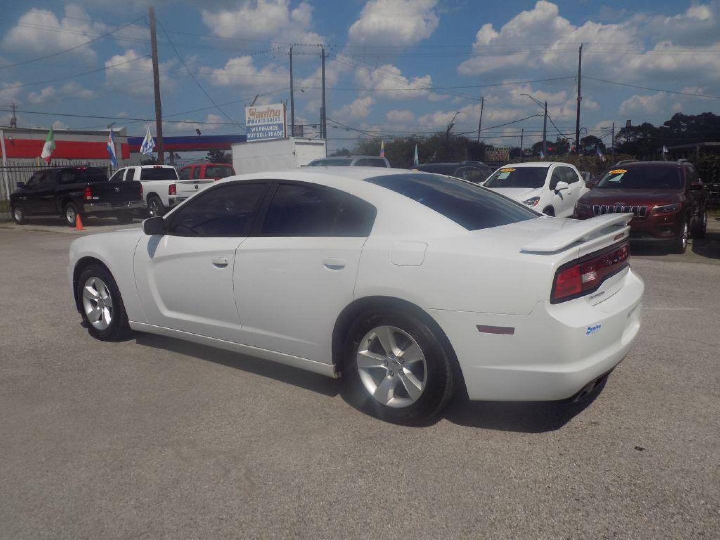 2014 WHITE DODGE CHARGER SE (2C3CDXBGXEH) with an 3.6L engine, Automatic transmission, located at 830 E. Canino Rd., Houston, TX, 77037, (281) 405-0440, 38.358219, -81.729942 - Photo#4