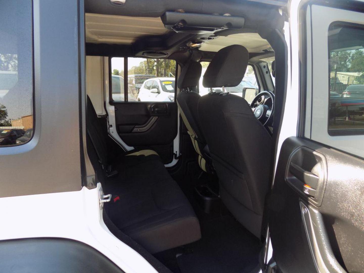 2014 WHITE JEEP WRANGLER UNLIMI SPORT (1C4BJWDG5EL) with an 3.6L engine, Automatic transmission, located at 830 E. Canino Rd., Houston, TX, 77037, (281) 405-0440, 38.358219, -81.729942 - Photo#11