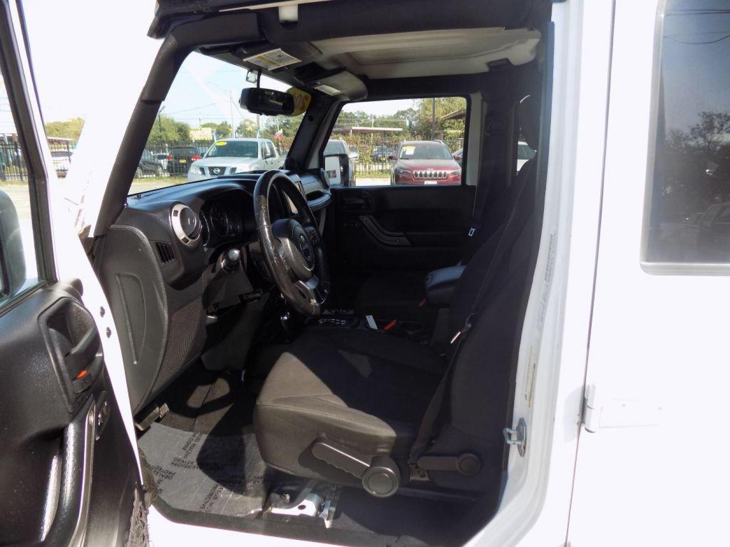 2014 WHITE JEEP WRANGLER UNLIMI SPORT (1C4BJWDG5EL) with an 3.6L engine, Automatic transmission, located at 830 E. Canino Rd., Houston, TX, 77037, (281) 405-0440, 38.358219, -81.729942 - Photo#14