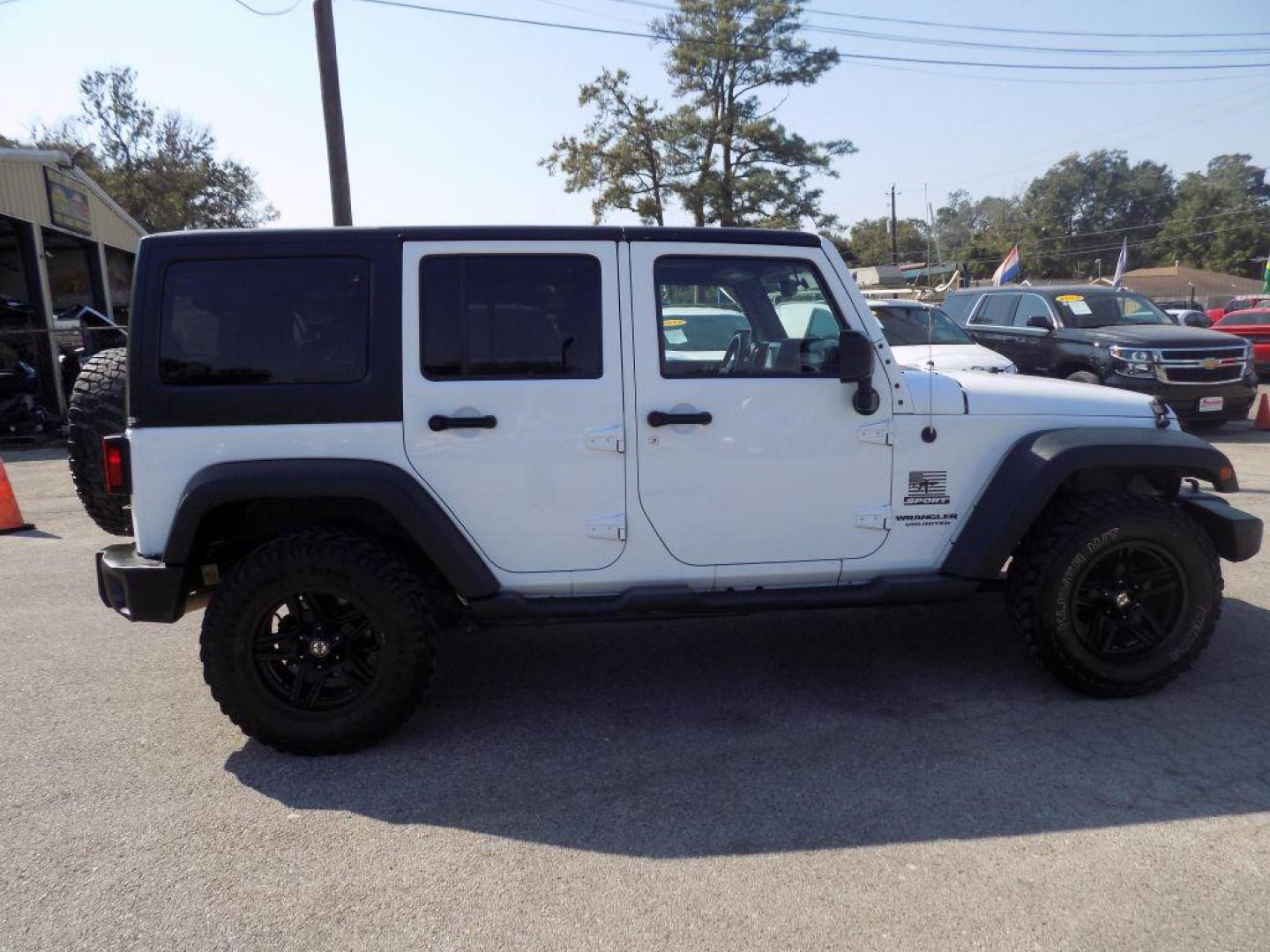 2014 WHITE JEEP WRANGLER UNLIMI SPORT (1C4BJWDG5EL) with an 3.6L engine, Automatic transmission, located at 830 E. Canino Rd., Houston, TX, 77037, (281) 405-0440, 38.358219, -81.729942 - Photo#1