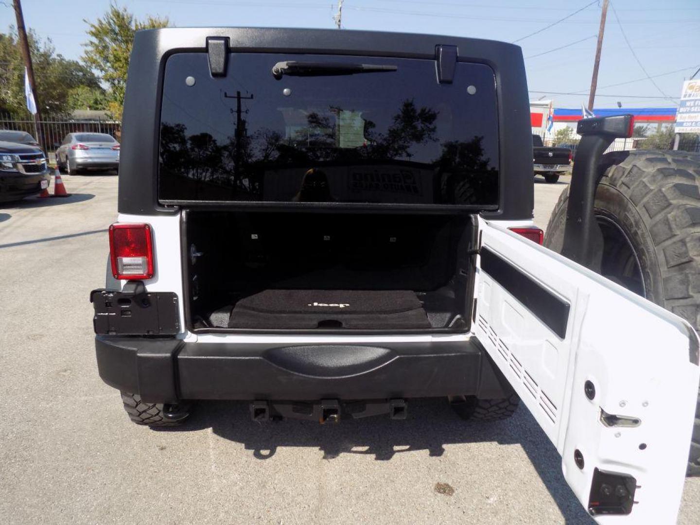 2014 WHITE JEEP WRANGLER UNLIMI SPORT (1C4BJWDG5EL) with an 3.6L engine, Automatic transmission, located at 830 E. Canino Rd., Houston, TX, 77037, (281) 405-0440, 38.358219, -81.729942 - Photo#20