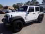 2014 WHITE JEEP WRANGLER UNLIMI SPORT (1C4BJWDG5EL) with an 3.6L engine, Automatic transmission, located at 830 E. Canino Rd., Houston, TX, 77037, (281) 405-0440, 38.358219, -81.729942 - Photo#5