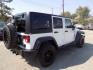 2014 WHITE JEEP WRANGLER UNLIMI SPORT (1C4BJWDG5EL) with an 3.6L engine, Automatic transmission, located at 830 E. Canino Rd., Houston, TX, 77037, (281) 405-0440, 38.358219, -81.729942 - Photo#7