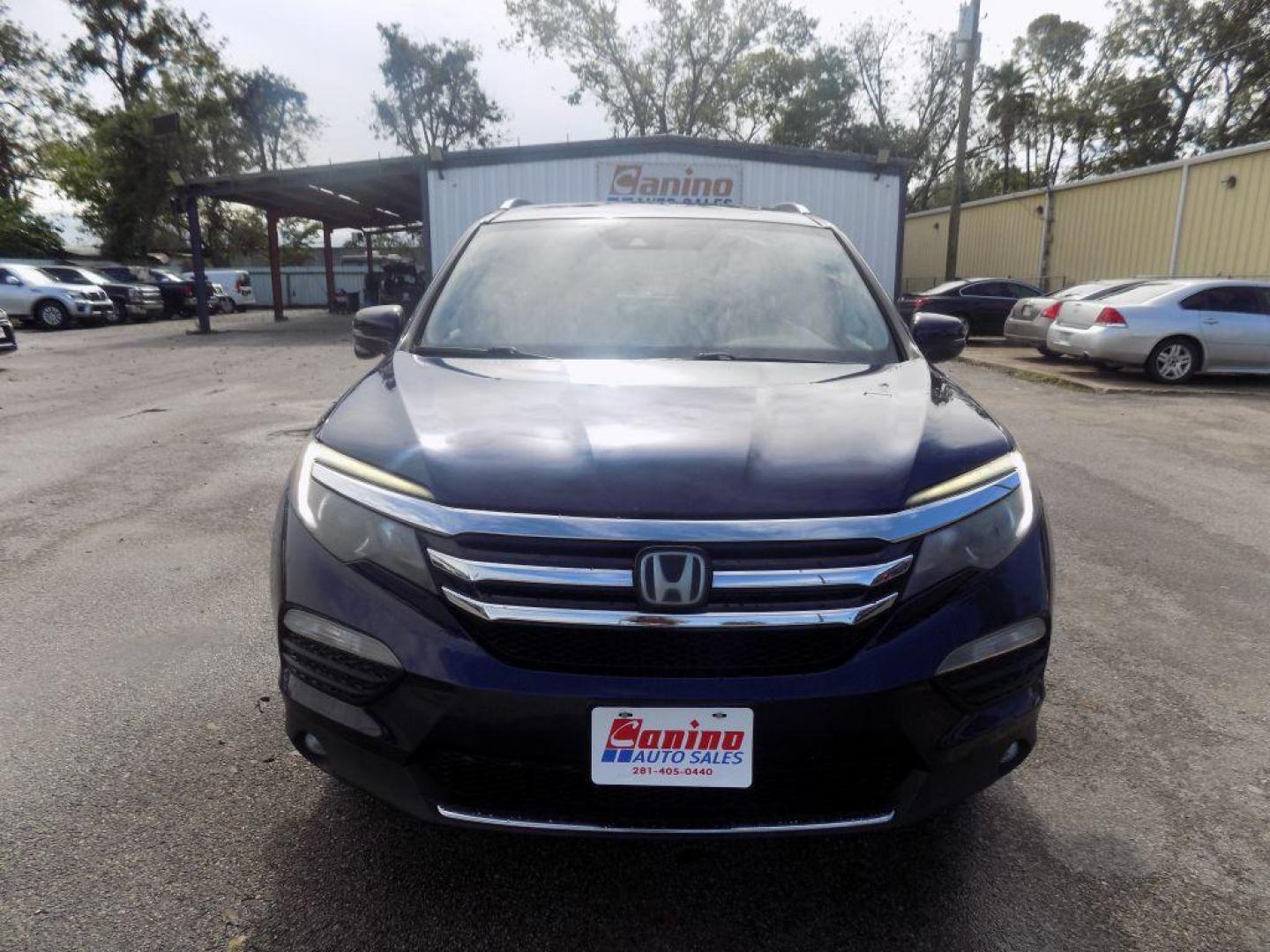 2017 BLUE HONDA PILOT TOURING (5FNYF5H98HB) with an 3.5L engine, Automatic transmission, located at 830 E. Canino Rd., Houston, TX, 77037, (281) 405-0440, 38.358219, -81.729942 - Photo#0