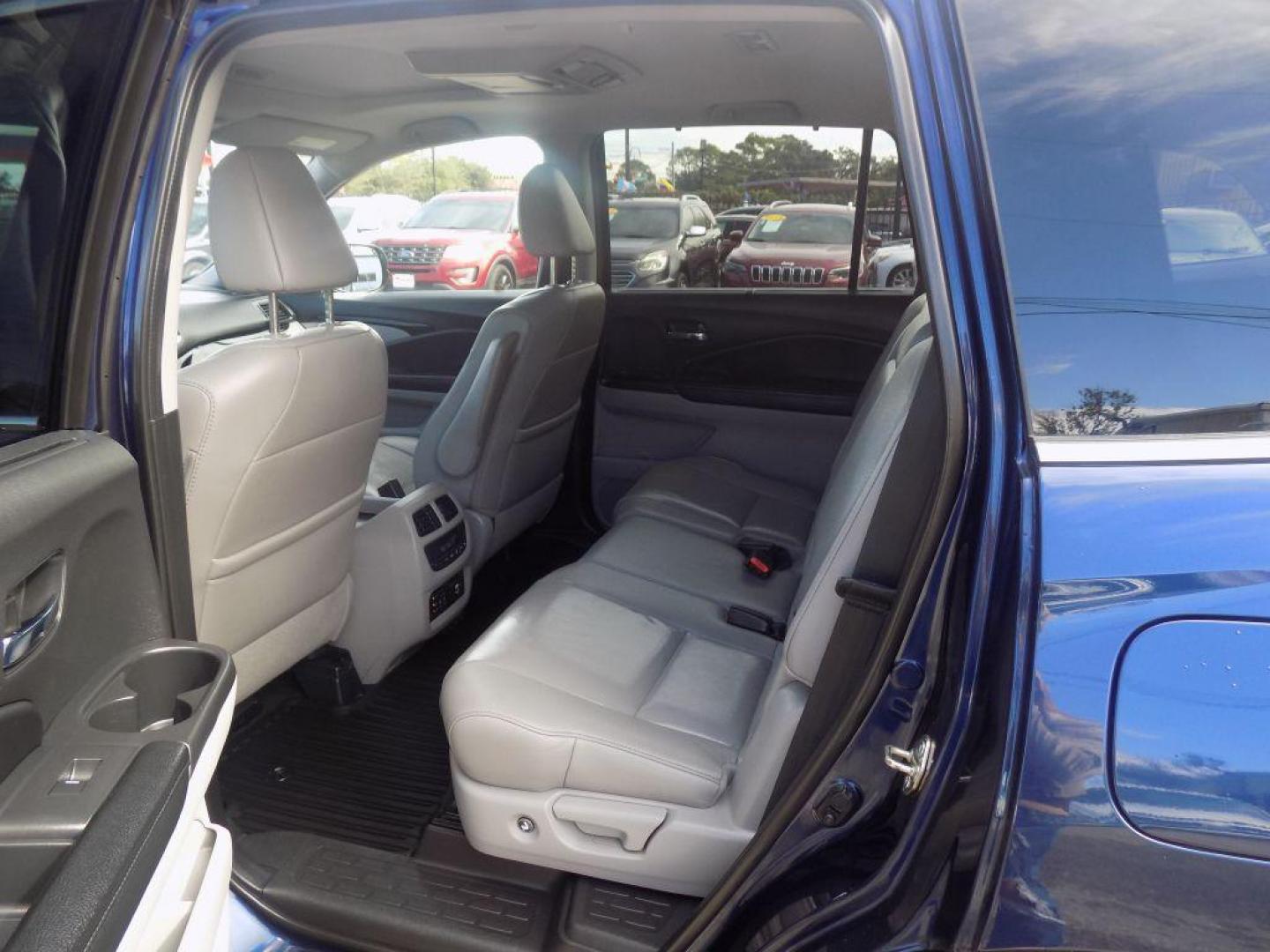 2017 BLUE HONDA PILOT TOURING (5FNYF5H98HB) with an 3.5L engine, Automatic transmission, located at 830 E. Canino Rd., Houston, TX, 77037, (281) 405-0440, 38.358219, -81.729942 - Photo#11