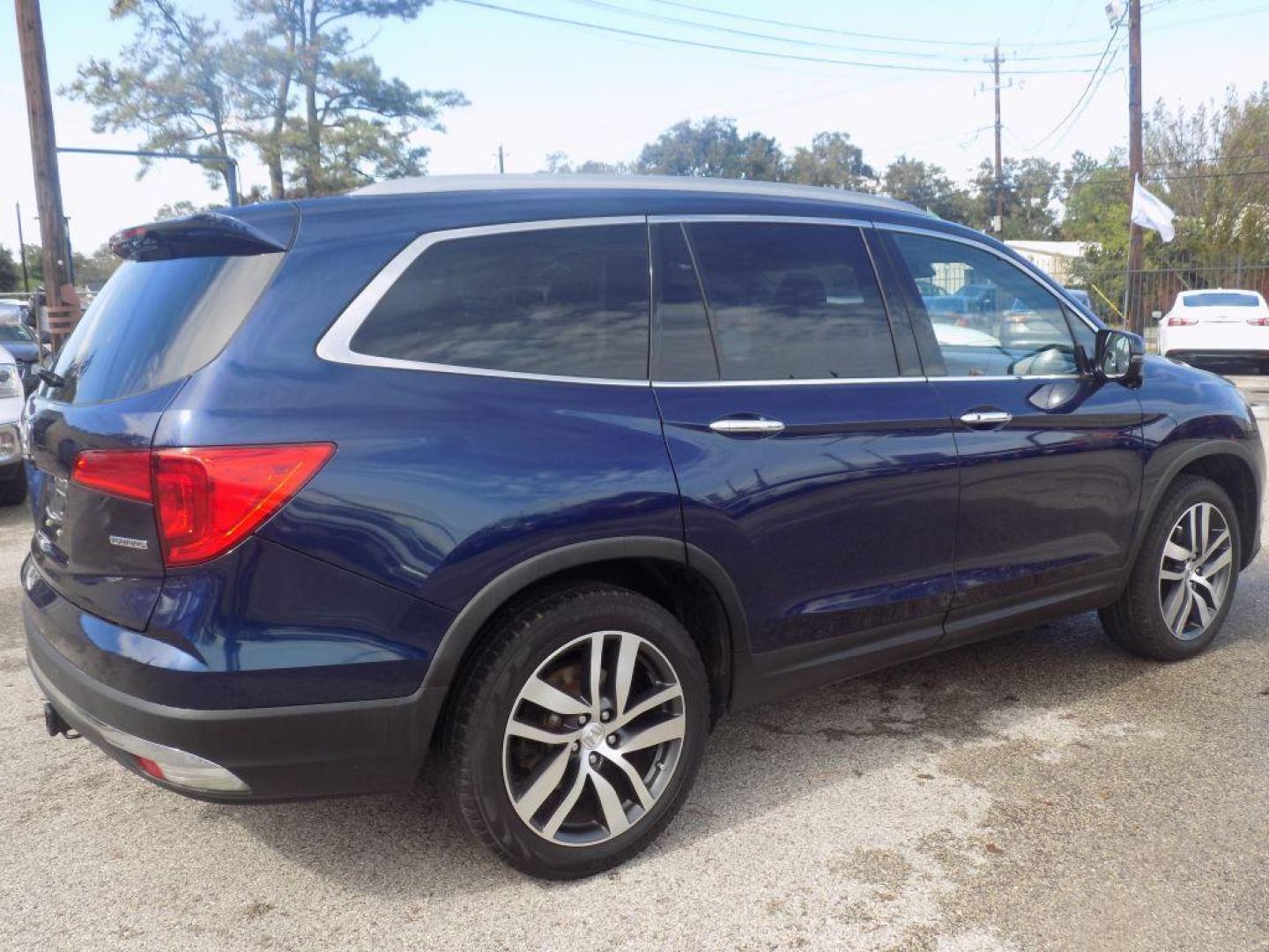 2017 BLUE HONDA PILOT TOURING (5FNYF5H98HB) with an 3.5L engine, Automatic transmission, located at 830 E. Canino Rd., Houston, TX, 77037, (281) 405-0440, 38.358219, -81.729942 - Photo#1