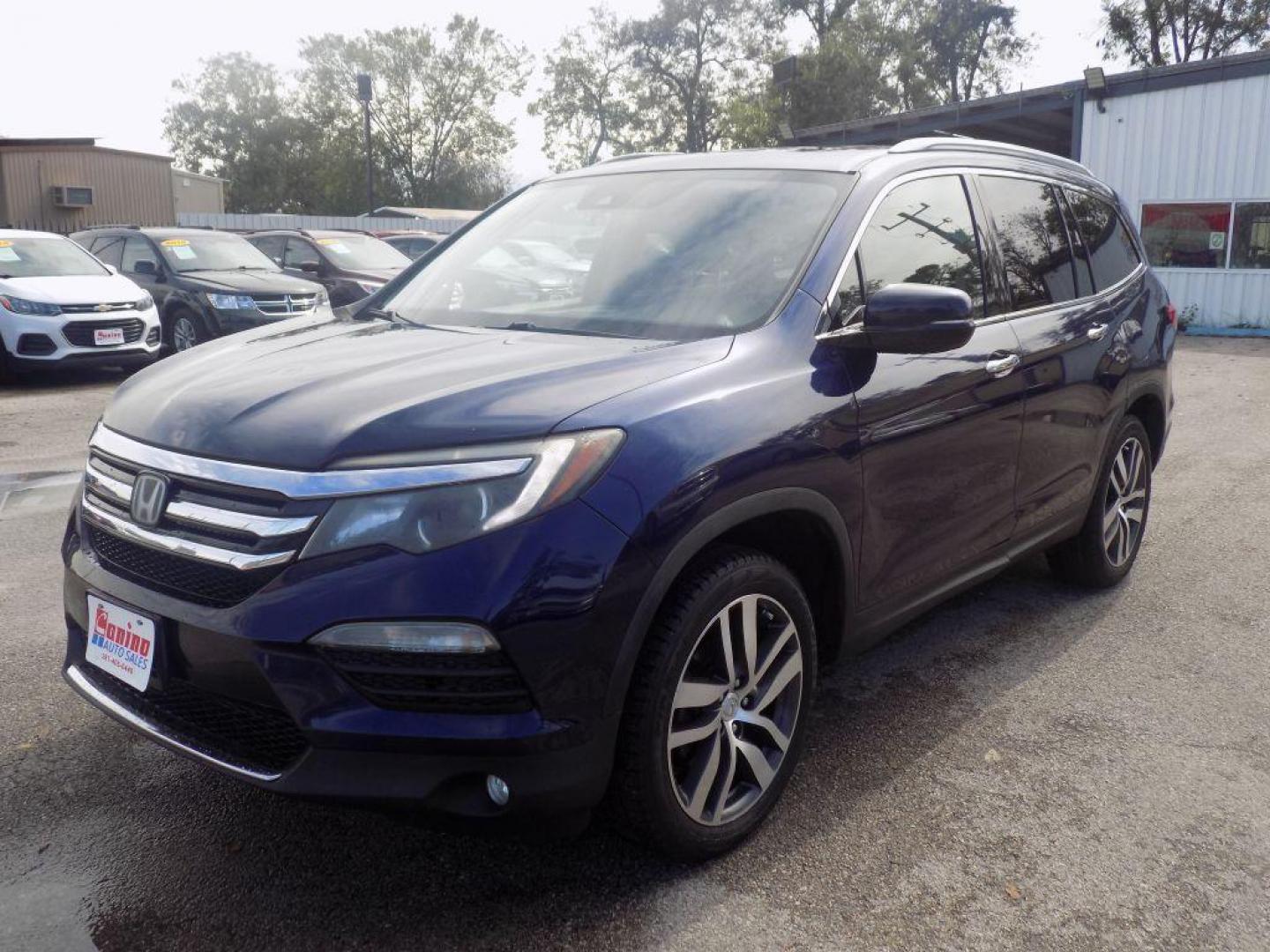 2017 BLUE HONDA PILOT TOURING (5FNYF5H98HB) with an 3.5L engine, Automatic transmission, located at 830 E. Canino Rd., Houston, TX, 77037, (281) 405-0440, 38.358219, -81.729942 - Photo#3