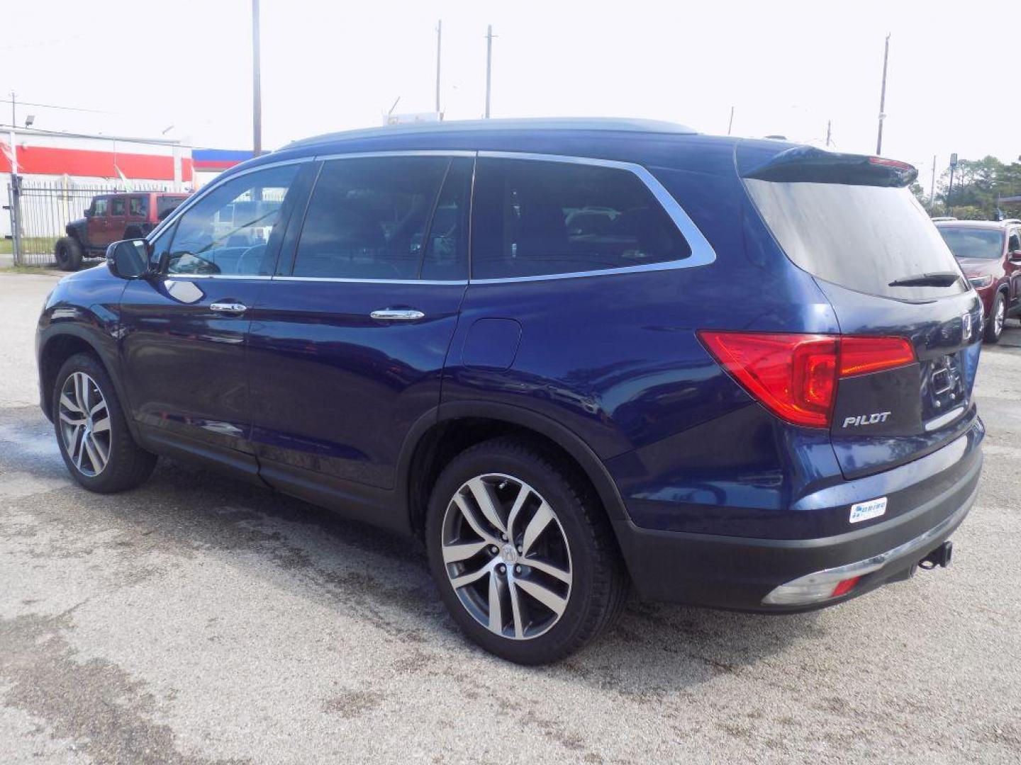 2017 BLUE HONDA PILOT TOURING (5FNYF5H98HB) with an 3.5L engine, Automatic transmission, located at 830 E. Canino Rd., Houston, TX, 77037, (281) 405-0440, 38.358219, -81.729942 - Photo#4