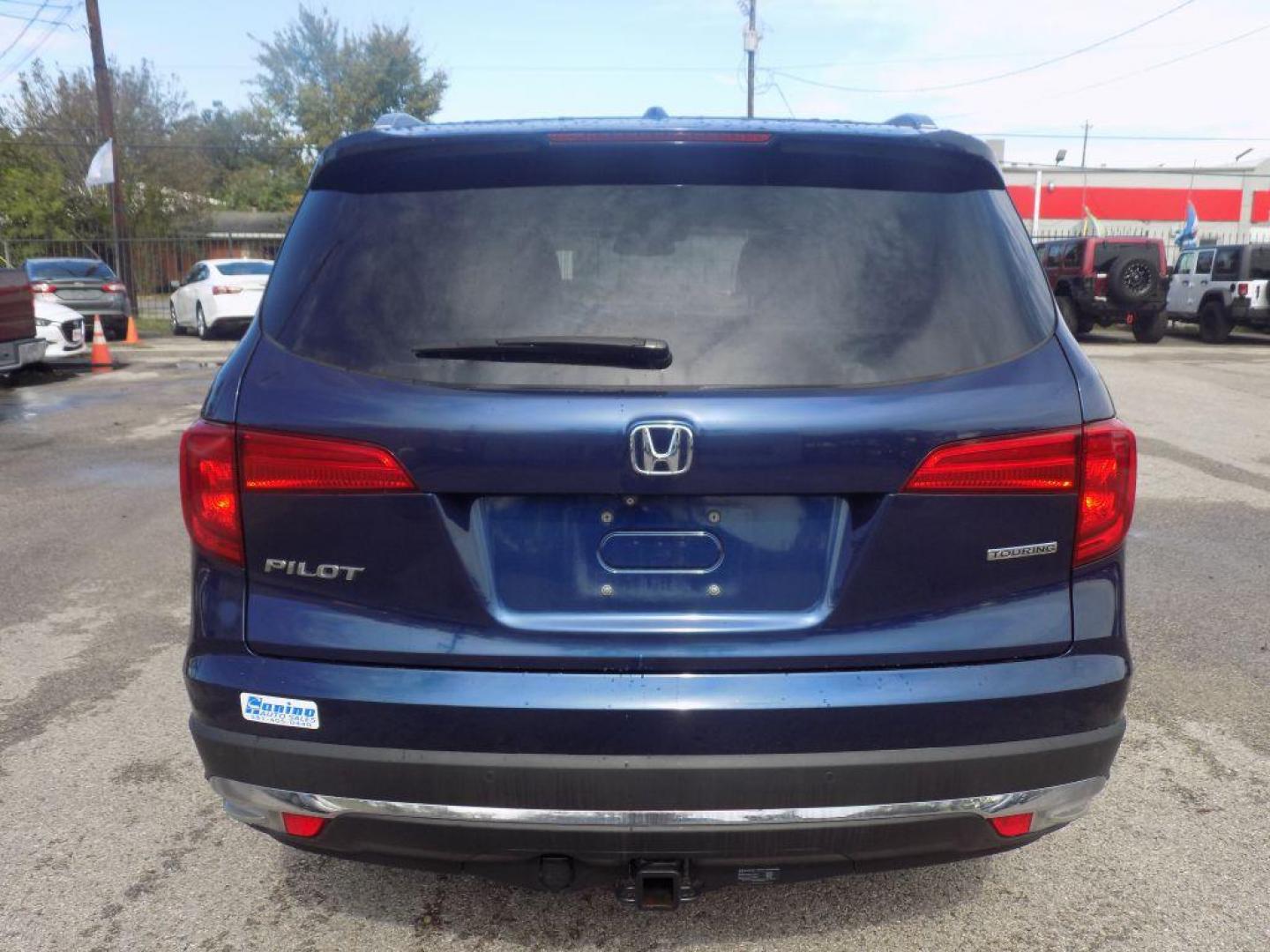 2017 BLUE HONDA PILOT TOURING (5FNYF5H98HB) with an 3.5L engine, Automatic transmission, located at 830 E. Canino Rd., Houston, TX, 77037, (281) 405-0440, 38.358219, -81.729942 - Photo#6