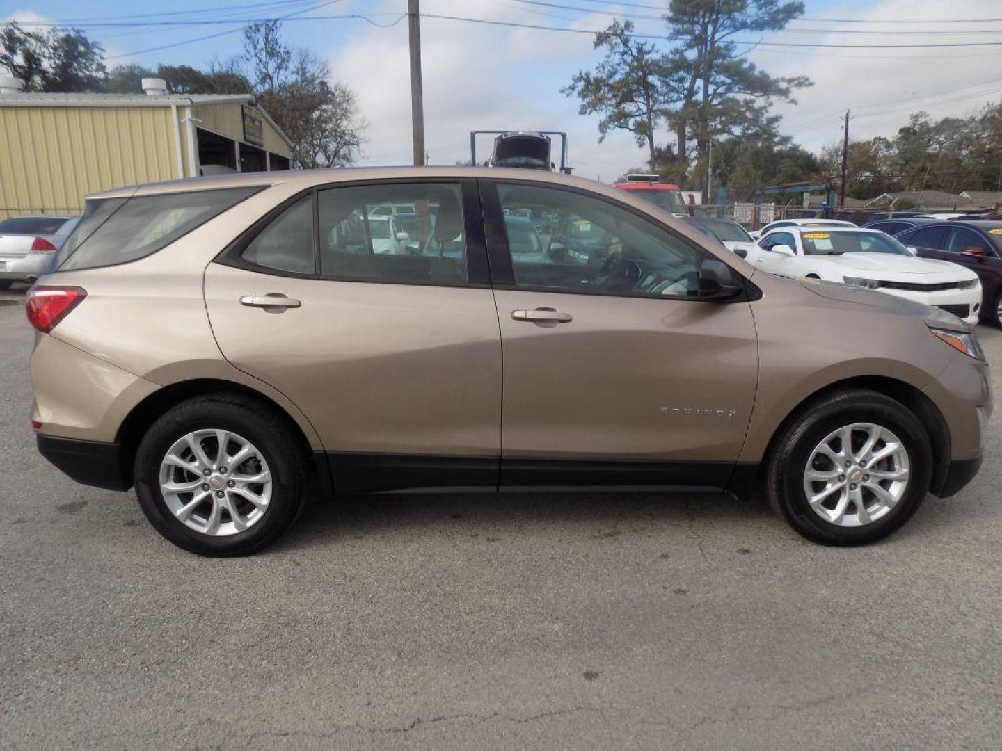 2019 GOLD CHEVROLET EQUINOX LS (2GNAXHEV9K6) with an 1.5L engine, Automatic transmission, located at 830 E. Canino Rd., Houston, TX, 77037, (281) 405-0440, 38.358219, -81.729942 - Photo#1