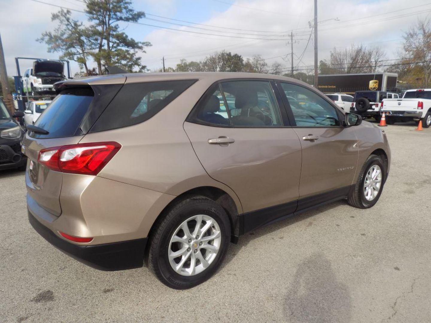 2019 GOLD CHEVROLET EQUINOX LS (2GNAXHEV9K6) with an 1.5L engine, Automatic transmission, located at 830 E. Canino Rd., Houston, TX, 77037, (281) 405-0440, 38.358219, -81.729942 - Photo#7